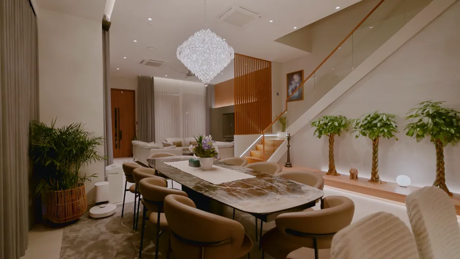 Dining room with a marble table and sculptural chandelier