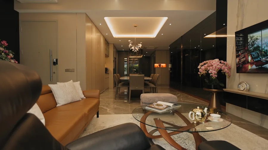 Living room with leather seating and marble finishes