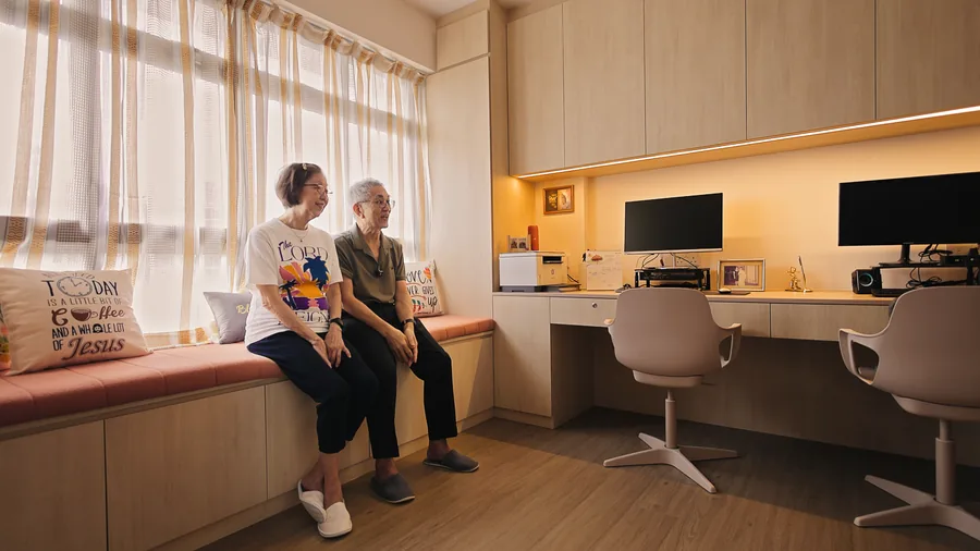 Two people in a completed home workspace