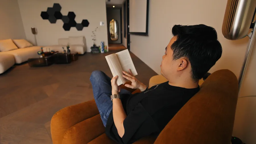 A homeowner reading in a completed living room