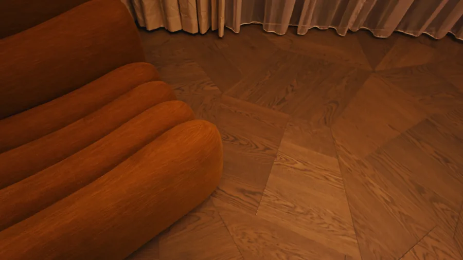 Living room with a curved rust velvet sofa on parquet